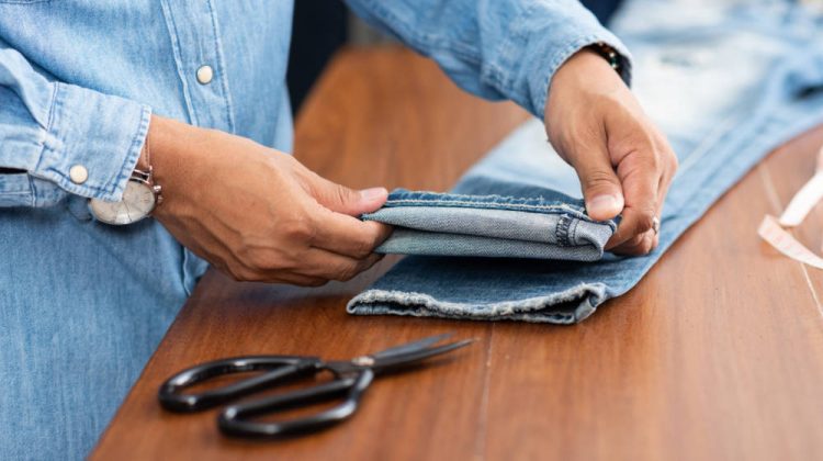 tailor working blue denim jeans hem | Genius Ideas In Hemming Pants | From First Stitch to Finished Piece | Featured