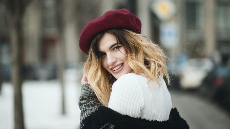 selective focus photography of smiling woman wearing red hat during snowy day | Winter Trends | Upcycling Ideas For Your Clothes & Fabric Scraps | Featured