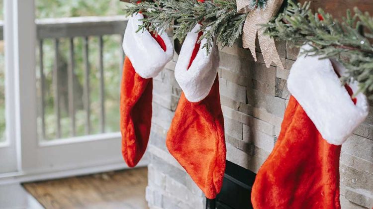 xmas decorations on brick wall above fireplace | Festive Christmas Stockings You Can DIY And Sew For The Holiday | Featured