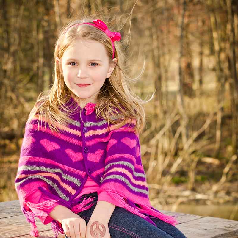 winter early spring portrait pretty young | knitted poncho