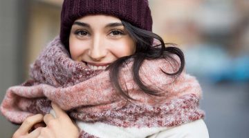 closeup face young happy woman enjoying | How to Make a Fleece Scarf | Featured