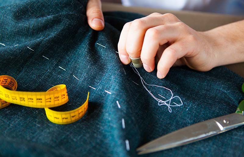 tailor man working his shop tailoring | basic sewing skills