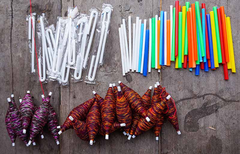 multicolored plastic straws tube roll | diy sewing room organization ideas