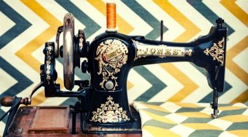 white and yellow chevron cloth on black sewing machine | Basic Sewing Machine Parts Every Beginner Should Know | Featured