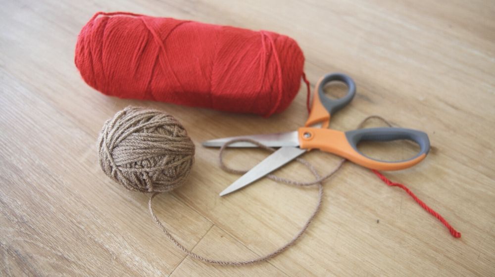 red tan yarn scissors layout | Essential Crochet Tools For Beginners