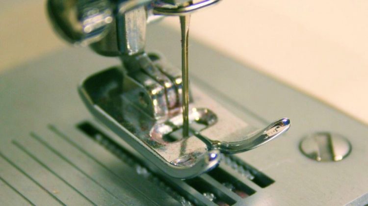 Closeup image of sewing machine foot | What's The Difference Between Quilting Machines and Sewing Machines? | Featured