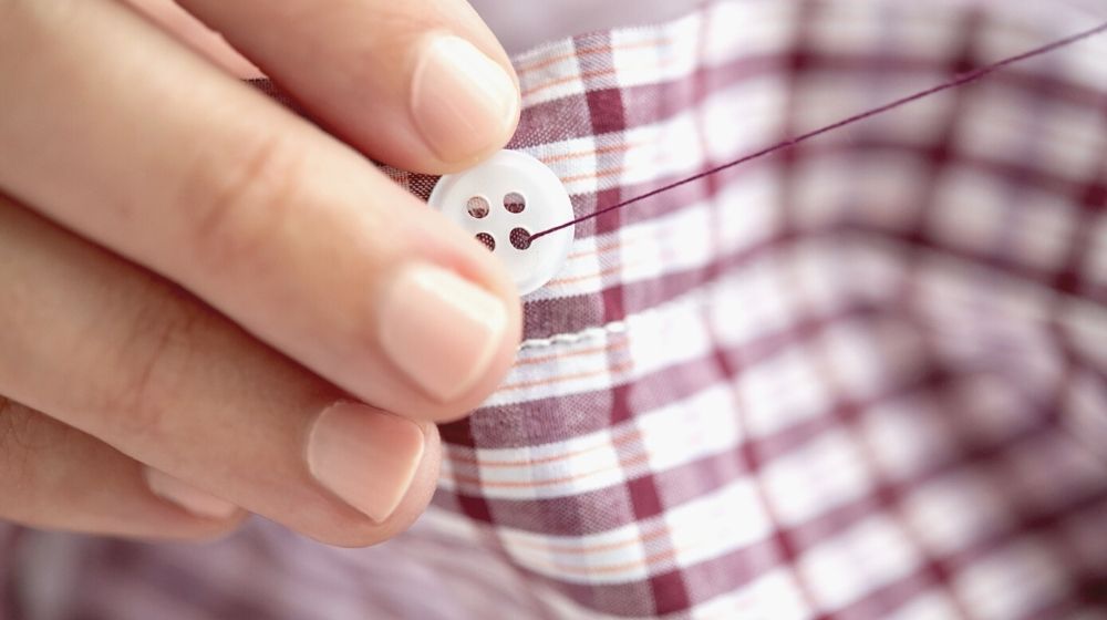 people needlework sewing tailoring concept | How To Sew A Button Like An Expert