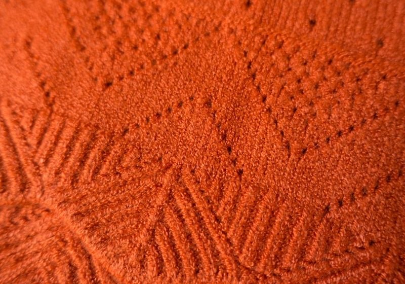 Cashmere fabric with geometric relief pattern and perforations | types of fabrics