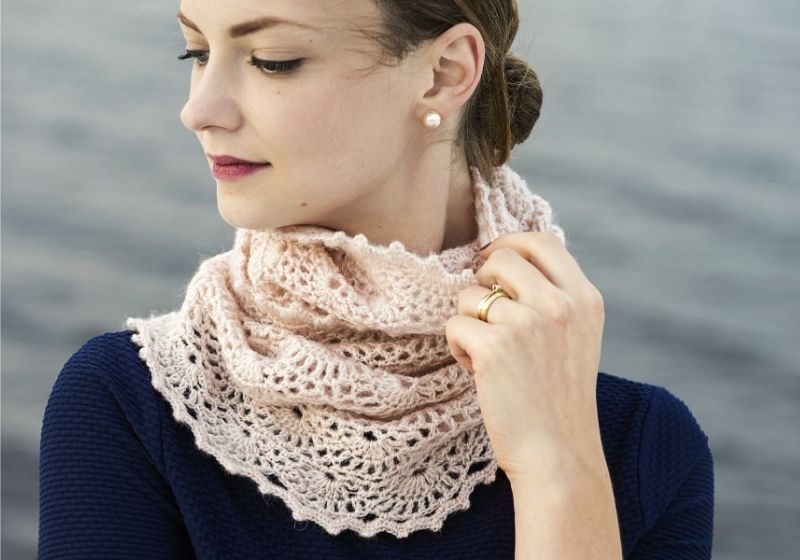 Young attractive woman wearing lacy crochet snood | infinity scarf crochet for beginners