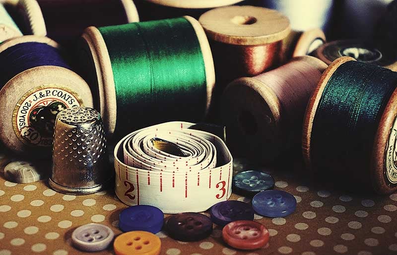 assorted color button pin on brown surface | basic sewing skills
