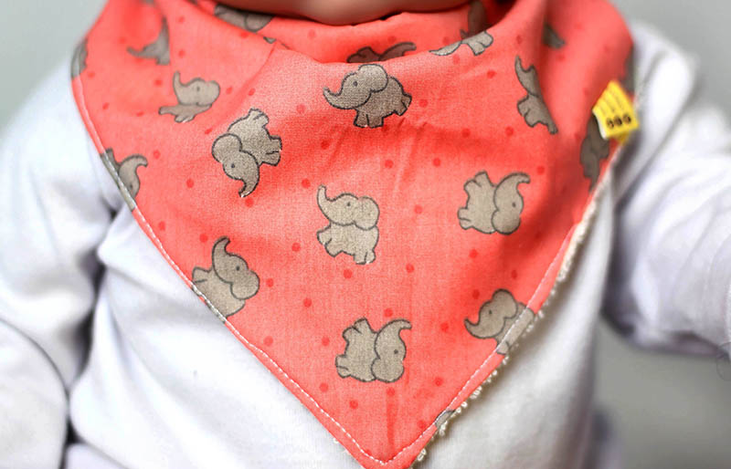baby doll wearing bandana bib portrait | easy sewing projects for beginners