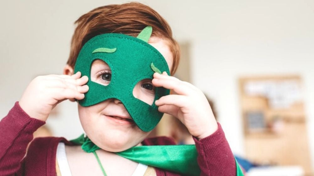 boy holding green mask | Fun Sewing Ideas For Moms and Kids