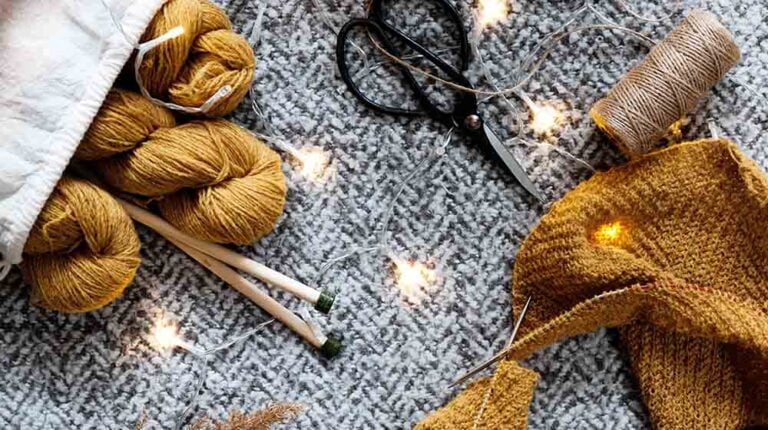 brown yarn on gray textile | Beginner Sewing Patterns You Can Do This Winter | Featured