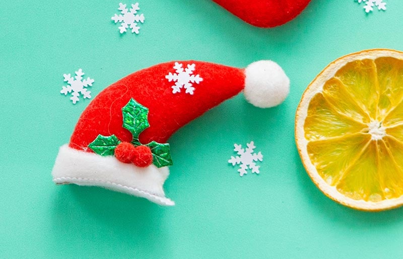 christmas flat lay on green background | christmas ornaments to sew
