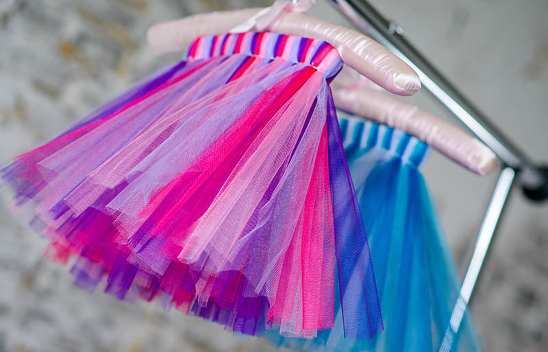 colored childrens skirt hanging on hanger baby | sewing for beginners
