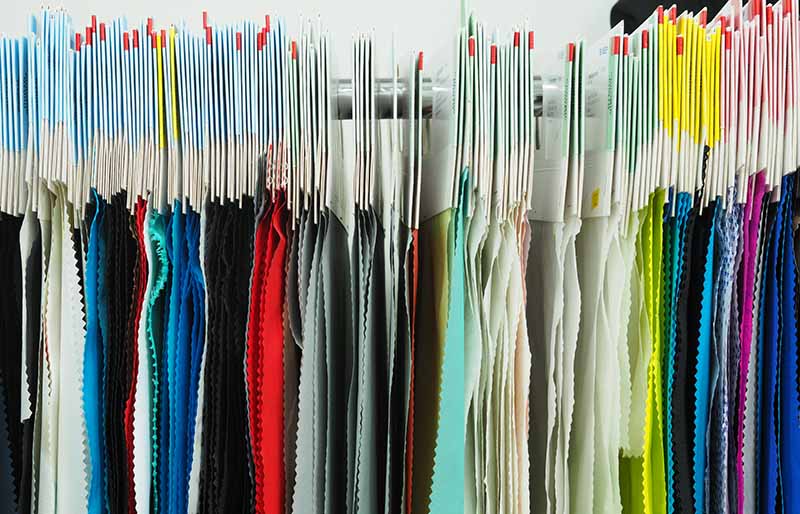 colorful fabric hangers woven swatches | fabric stash management