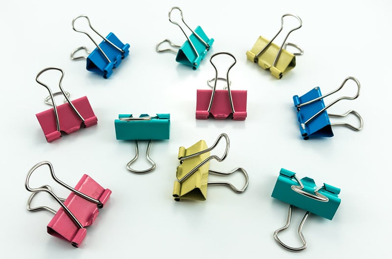 colorful multi color binder clips isolate | diy sewing room organization ideas