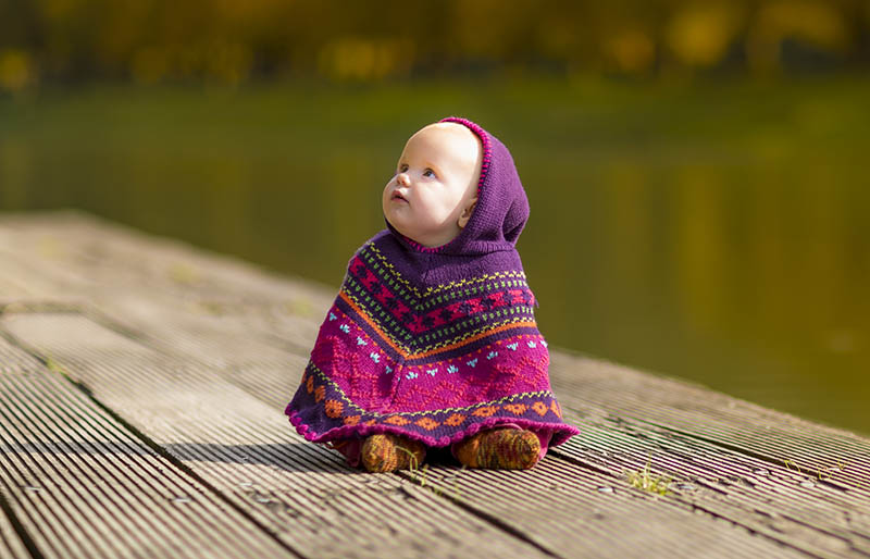 cute happy child baby playing outside | winter clothes for newborn