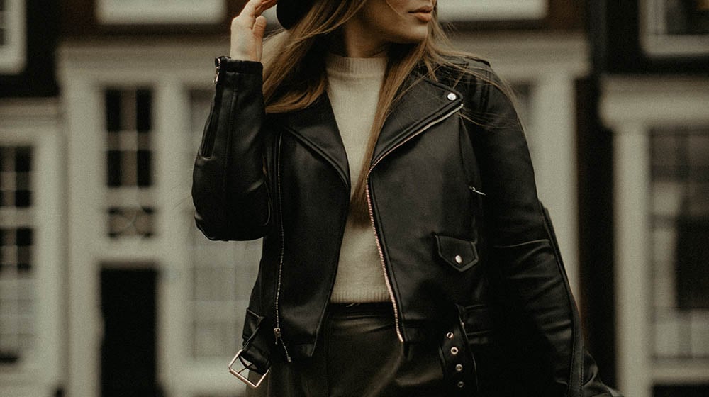 elegant woman standing in old town | Sewing Tutorial | Learn to Sew A Stylish Leather Bomber Jacket | Featured