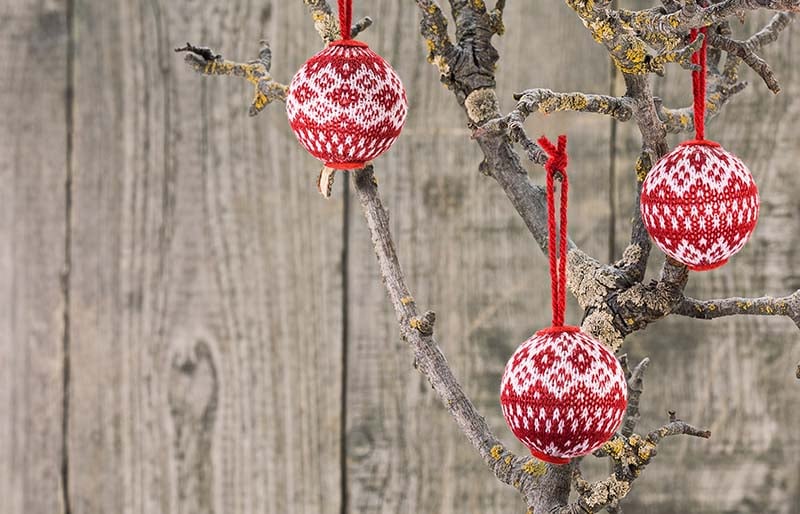 fabric christmas balls hanging on wooden | christmas ornaments to sew