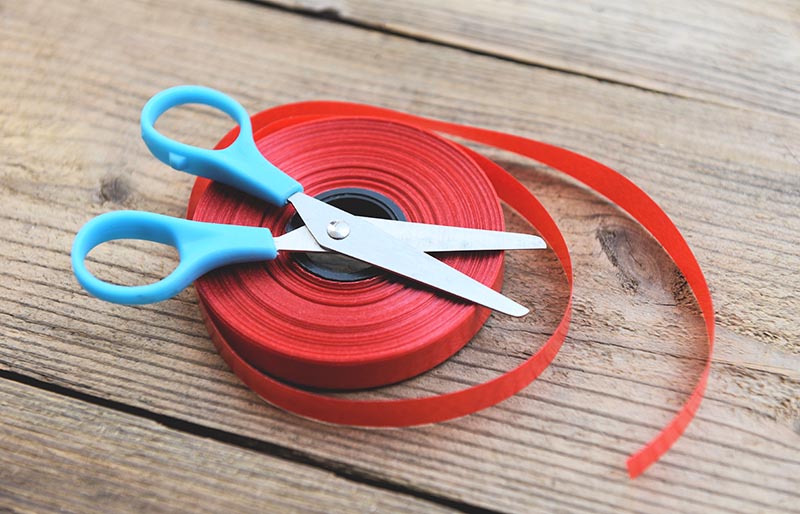 image photoroll red ribbon scissors on wooden | sewing hacks