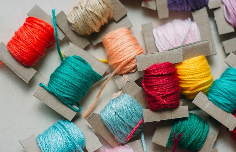 multicolor thread on cardboard embroidery floss | diy sewing room organization ideas