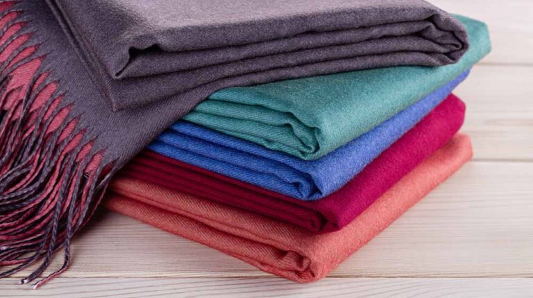 neatly stacked piles cashmere stoles shawls | How to Make a Shawl: Easy Sewing Method for Beginners | Featured