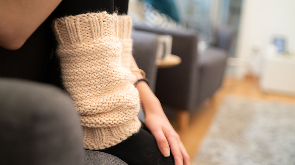 person wearing black socks | How To Sew Cozy Leg Warmers For You and Your Family | Featured