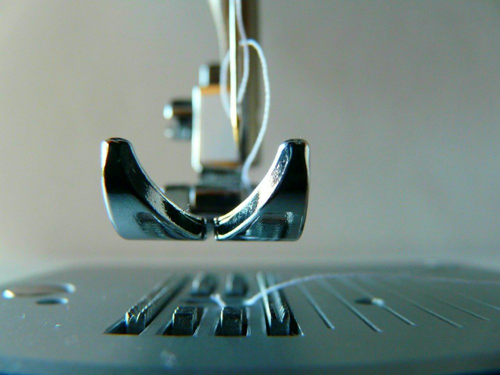 Closeup image of sewing machine needle and foot | What's The Difference Between Quilting Machines and Sewing Machines?