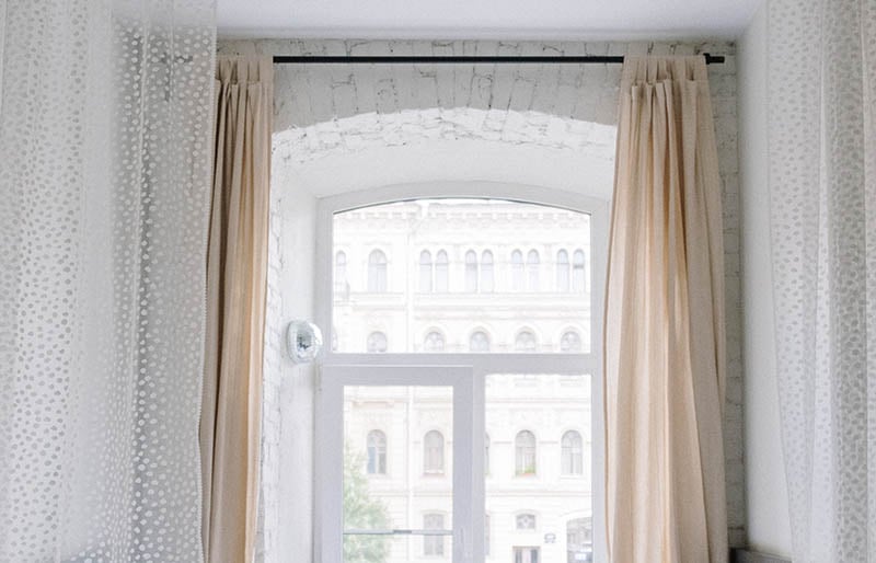 white window curtain near bed | rod pocket curtains
