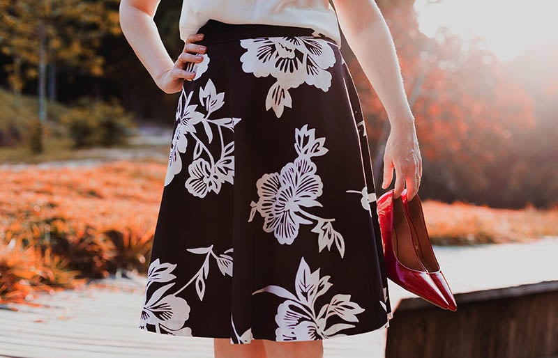 woman wearing skirt holding her shoes | easy sewing projects for beginners