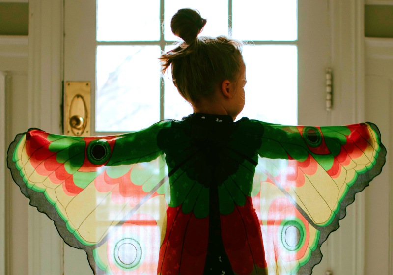 girl in black and red plaid jacket standing on white floor tiles | ## Spooktacular Halloween Costume Patterns You Can Sew For The Family | butterick costume patterns