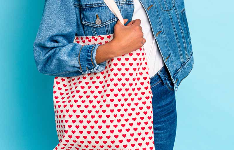 young african american curly woman holding bag | valentines day sewing project ideas