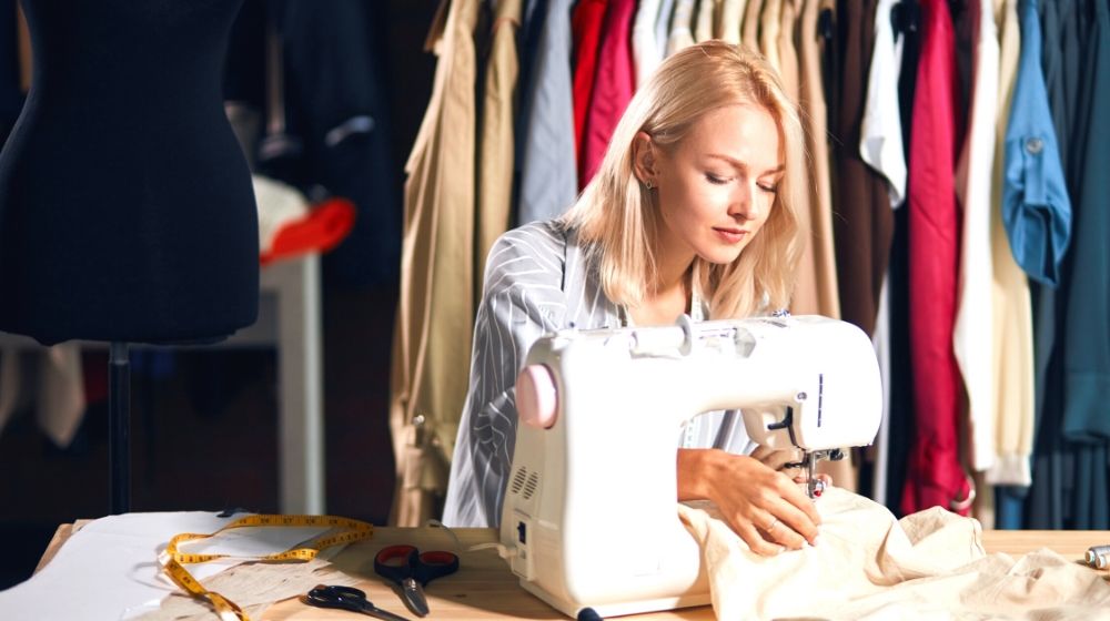 young blonde serious needlewoman studio working | How To Sew Your Own Silk Pillowcase | Featured