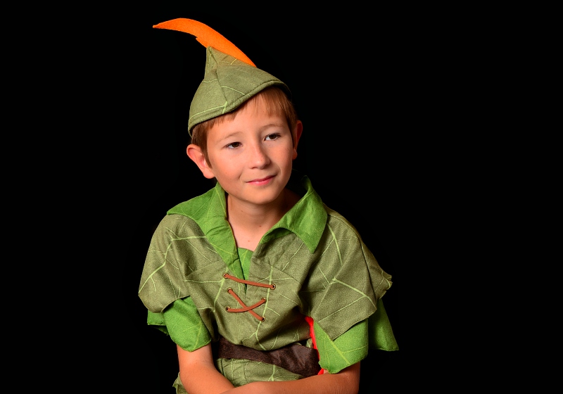 young boy dressed peter pan sitting | disney sewing patterns